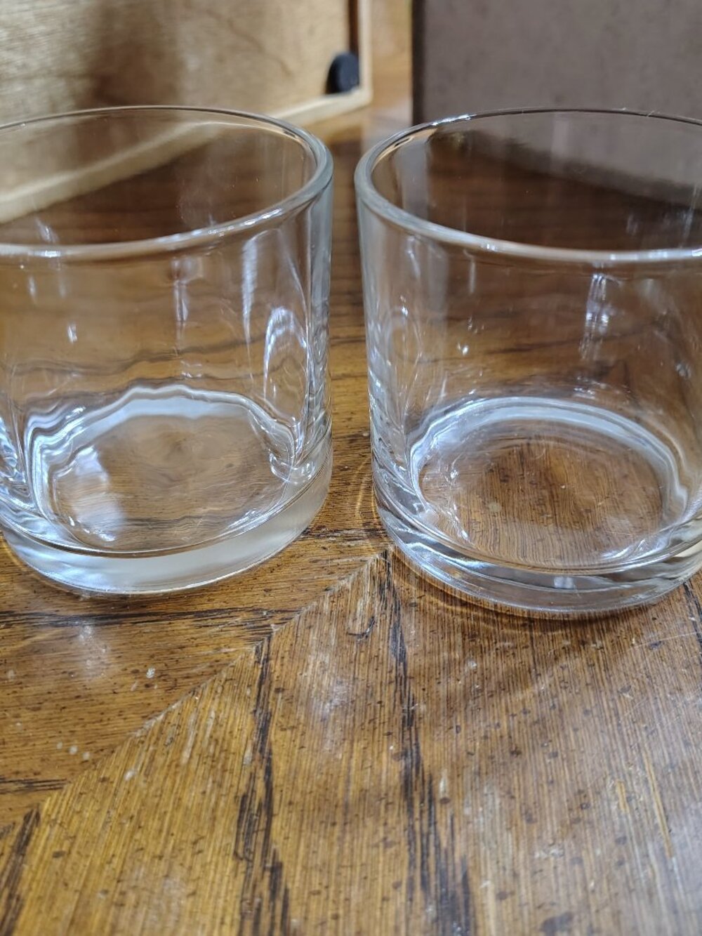 two short heavy bottomed glass tumbler